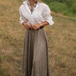 Traditional British style driven shooting including classic attire and things like Barbor Jackets, tweed and English shotguns and welly boots and plaid shirts and long tweed skirts like this one from Millen